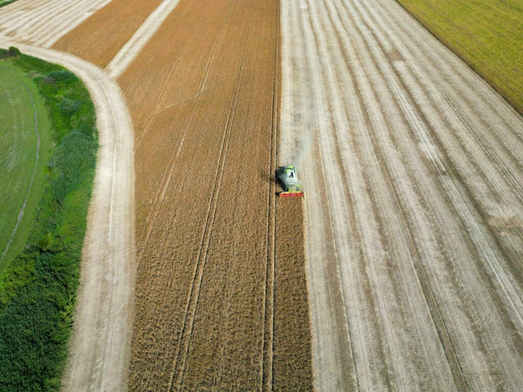 a combine harvester working in a field in garesnica croatia captured from above. agricultural landscape. 18431216 2048x1536.jpg